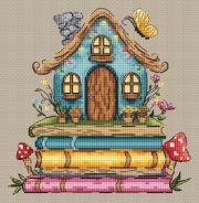 Метелик поряд зі стосом книг — фрагмент вишивки
