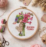Finished lamb embroidery framed in a wooden hoop